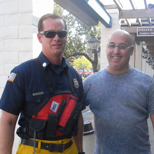 Dr. Klein posing with firefighter